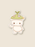 This is a sticker of a forest spirit with a green hat and white body