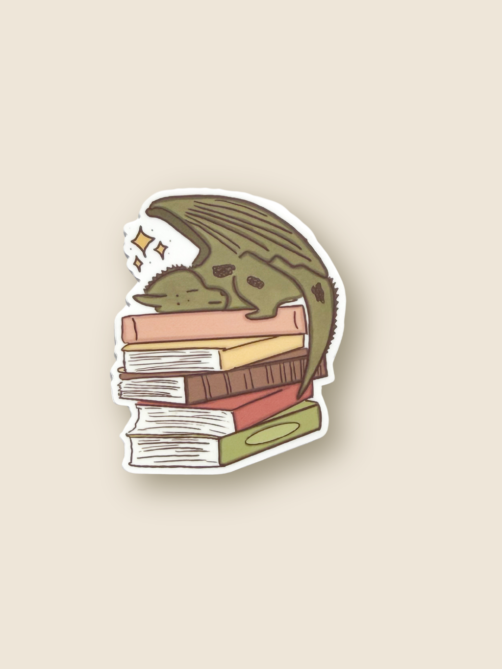 Sticker of a dragon sleeping on books on a beige background