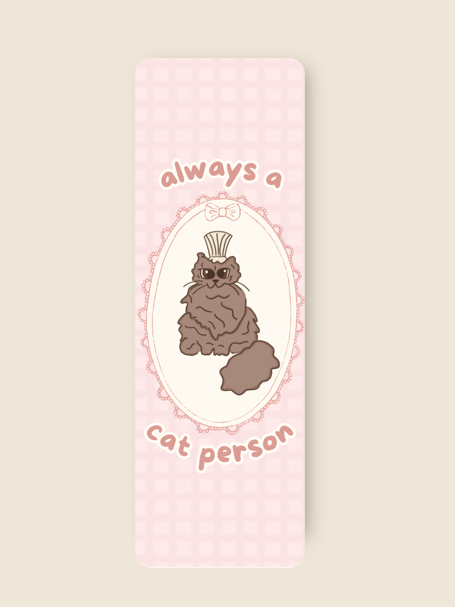 this is a pink bookmark featuring a brown cat
